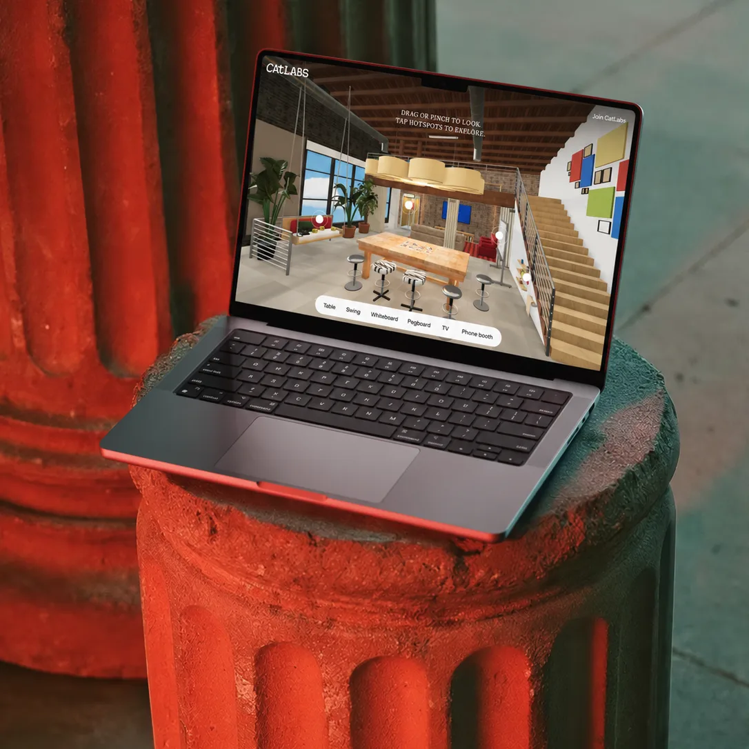Cat Labs interactive studio website on a MacBook mockup